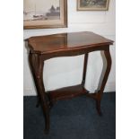 A mahogany occasional table with rectangular serpentine top, on cabriole legs, with undershelf,