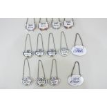 A collection of decanter/spirit labels comprising seven Staffordshire porcelain labels for port (2),