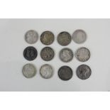A small collection of twelve Victorian and later silver threepenny coins dating from 1859 to 1920 (