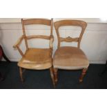 A pine bar back elbow chair, on turned supports and legs, and a dining chair with carved back