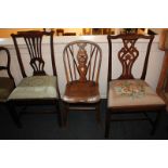 Two Chippendale style mahogany dining chairs, one with pierced vase splat, the other a ribbon