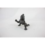 An Indian bronze figure of a deity, possibly Krishna as a crawling child, 8cm