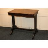 A Victorian mahogany rectangular side table with twin end supports and four fluted legs with
