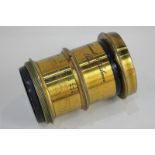 A Clement & Gilmer, Paris, brass cased camera lens, 7cm diameter by 10cm long