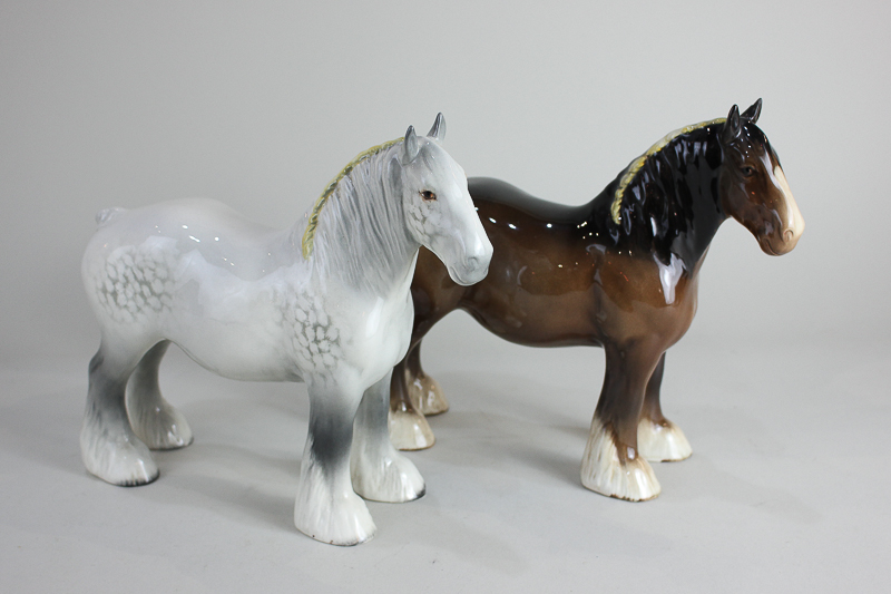 Two Beswick models of a shire horse, grey, gloss and brown, gloss, both with yellow ribbon, 21.6cm