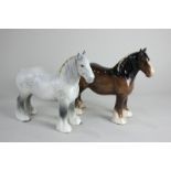 Two Beswick models of a shire horse, grey, gloss and brown, gloss, both with yellow ribbon, 21.6cm