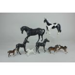 A Beswick model of Black Beauty, black and white, matt, 17.8cm, and two foals, black and white,