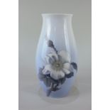 A Bing & Grondhal Copenhagen porcelain vase decorated with a white flower, 21cm