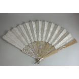 A boxed white lace fan with mother of pearl guards, 49cm extended