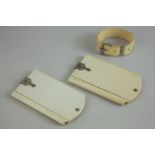 Two small Victorian ivory notepads with six hinged leaves impressed with the days of the week, and a