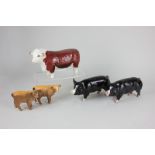 Two Beswick models of a Berkshire boar, black and grey, gloss, 8.2cm, together with a Beswick figure