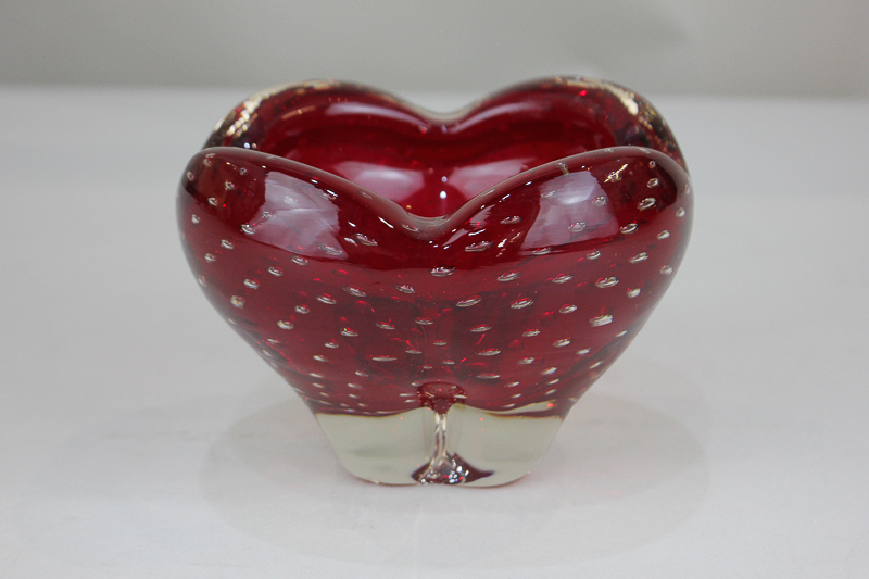 A Whitefriars red glass molar vase with controlled bubble design, designed by Geoffrey Baxter (