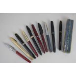 A collection of ten fountain pens, makers include Parker, Sheaffer, and Watermans