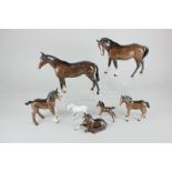 Two Beswick models of horses, brown, gloss, tallest 20cm, together with five Beswick foals,