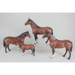 Two Beswick models of horses, 'The Winner', brown, matt, both 24cm, together with a Beswick horse,