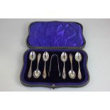 A cased set of six George V silver teaspoons and tongs, maker Wakely & Wheeler, London 1912, 2.5oz