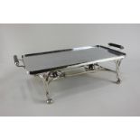 A silver plated rectangular two-handled metal hot plate serving stand with twin spirit burners, on