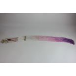 A 1920's flapper dress beaded tassel with synthetic pearls and purple-to-clear graduated colour