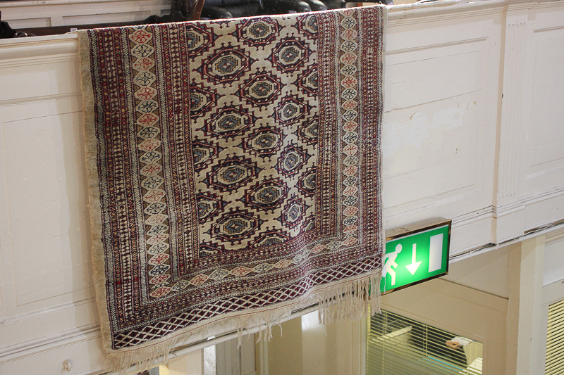 A Turkoman type rug, cream ground with central panel of geometric diamond motifs within multiguard