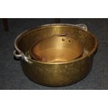 A large brass circular preserve/pickling pan with swing handle, 45cm, and another smaller pan, 30cm