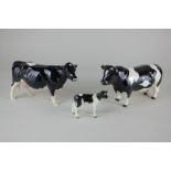 Three Beswick models of cattle, comprising a Friesian bull 'Ch Coddington Hilt Bar', black and