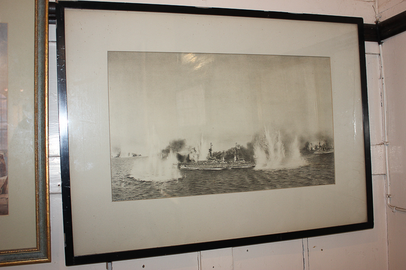 A monochrome print of warships at battle, 29cm by 50cm