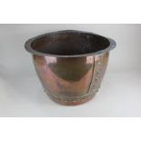 An Arts and Crafts large copper jardiniere plant pot of rivet construction, diameter 46cm