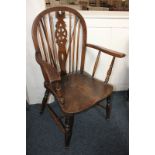 A Windsor armchair with wheel back splat