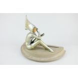 A book end with Art Deco style figure in the style of Gerda Gerdago, seated on a wooden base, 20.5cm