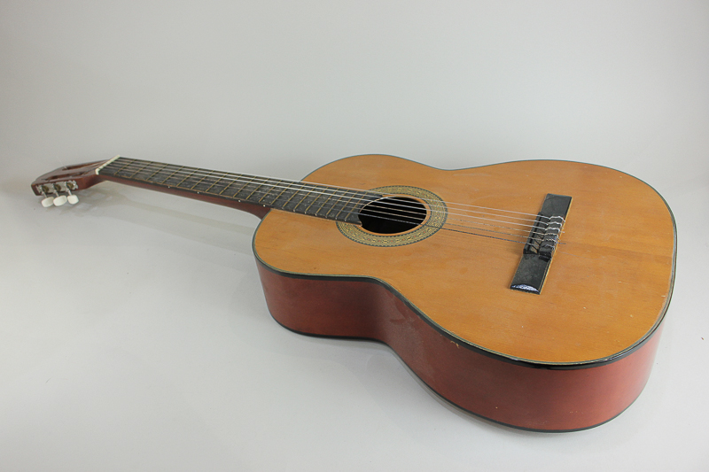 A Paramount Grand Concert acoustic guitar with inlaid design on blond wood, with case, 100cm