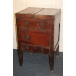 A George III mahogany enclosed wash stand with double lift-up flap top, cupboard and drawer below,