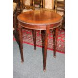 A mahogany circular side table with gadroon carved border, on tapered legs with pad feet, 62cm