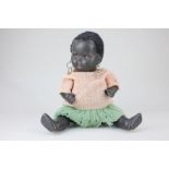 A black baby doll with brown sleeping eyes and short black hair, 39.5cm