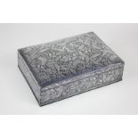 An eastern metal dressing table box, possibly from Thailand, rectangular shape with floral overlay
