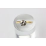 A diamond single stone ring, six-claw set above a heart pierced gallery in platinum on 18ct yellow