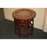 An inlaid Ottoman circular occasional table with floral decoration, on arched support, 45cm,