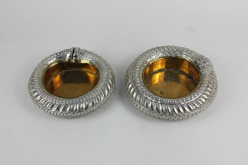 Two similar African silver plated anklets modified into dishes