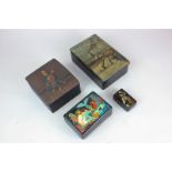 A collection of four Russian black lacquer boxes, one depicting a snowy scene, marked Feyiekani,