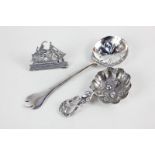 A Victorian silver caddy spoon with embossed leaf and fruiting vine form (marks obscured),