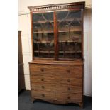 A George III inlaid mahogany secretaire bookcase with pendant cornice and two glazed panel doors