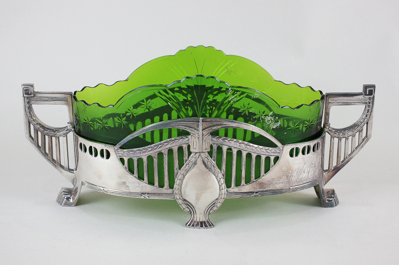 A WMF Art Nouveau oval table centre bowl, twin handled with green glass liner