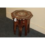 An inlaid Ottoman octagonal occasional table with floral decoration, on arched support, 31cm