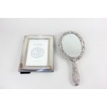 An Elizabeth II silver photograph frame with Celtic design, boxed, for photos 15cm x 10cm,