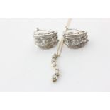 A pair of 14ct white gold and diamond ear clips set with baguette and brilliant cut diamonds, and