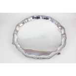 An Elizabeth II silver salver with gadrooned piecrust border, on three scroll feet, 32cm, maker