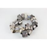 A collection of George V and later silver napkin rings, in various shapes and sizes, 12.5oz