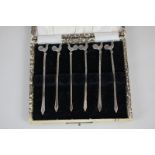 A George V silver cased set of six cocktail sticks with cockerel terminals, maker C W Fletcher,