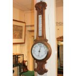 A carved oak aneroid wheel barometer, with thermometer, 91cm, (a/f)