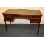 An Edwardian banded walnut writing desk with green leather inset rectangular top and five drawers,