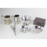 A pair of silver plated Indian coin inset dishes, a white metal pedestal bowl, a Continental